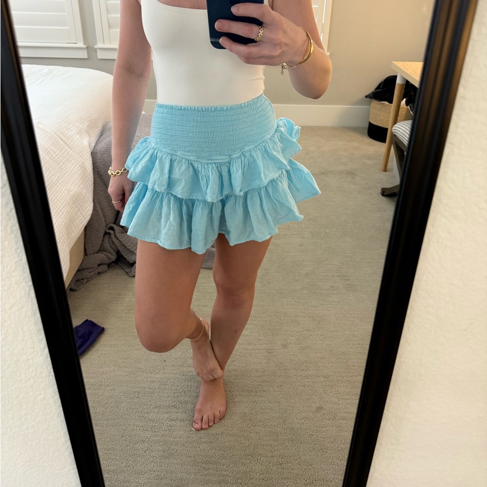 Light blue ruffled mini skirt